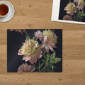 Memory Lane puzzle: Peonies in Bloom. The finished 30-piece 14″ × 11″ puzzle on a table beside its white gift box (product illustration)