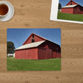 Memory Lane puzzle: Red Barn Morning. The finished 30-piece 14″ × 11″ puzzle on a table beside its white gift box (product illustration)